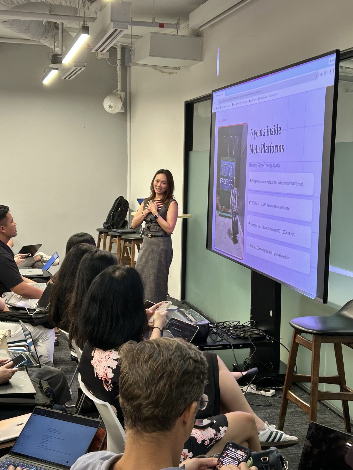 Community speaker Bow presenting her carousel workflow to a full room at AI Power Users Meetup 03