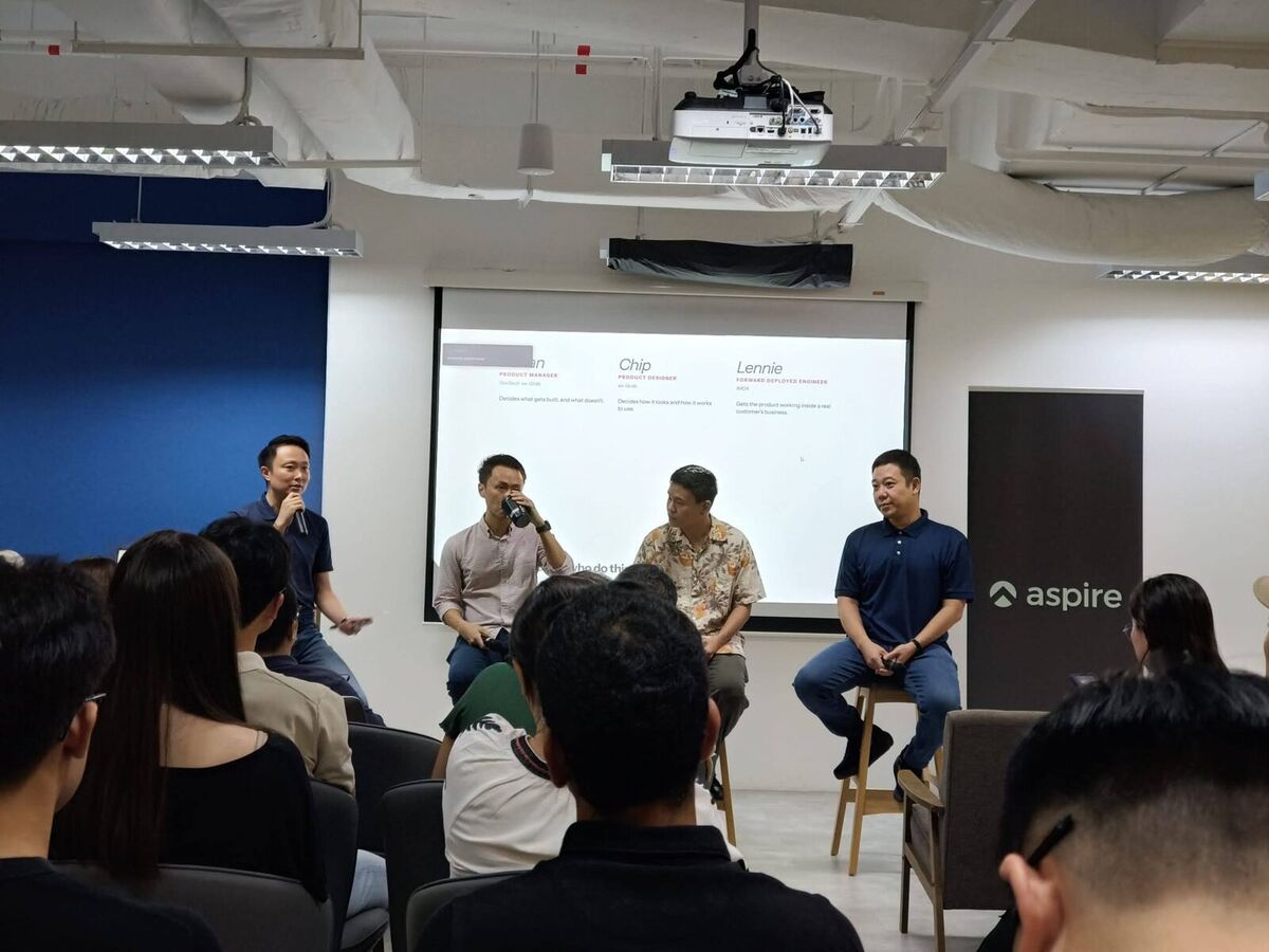 Keith Teo moderating the fireside panel with Adrian, Chip and Lennie seated on stage at AI Power Users Meetup 06, Aspire, Singapore